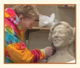 Jaime Blaise Cadegan working on a ceramic sculpture
