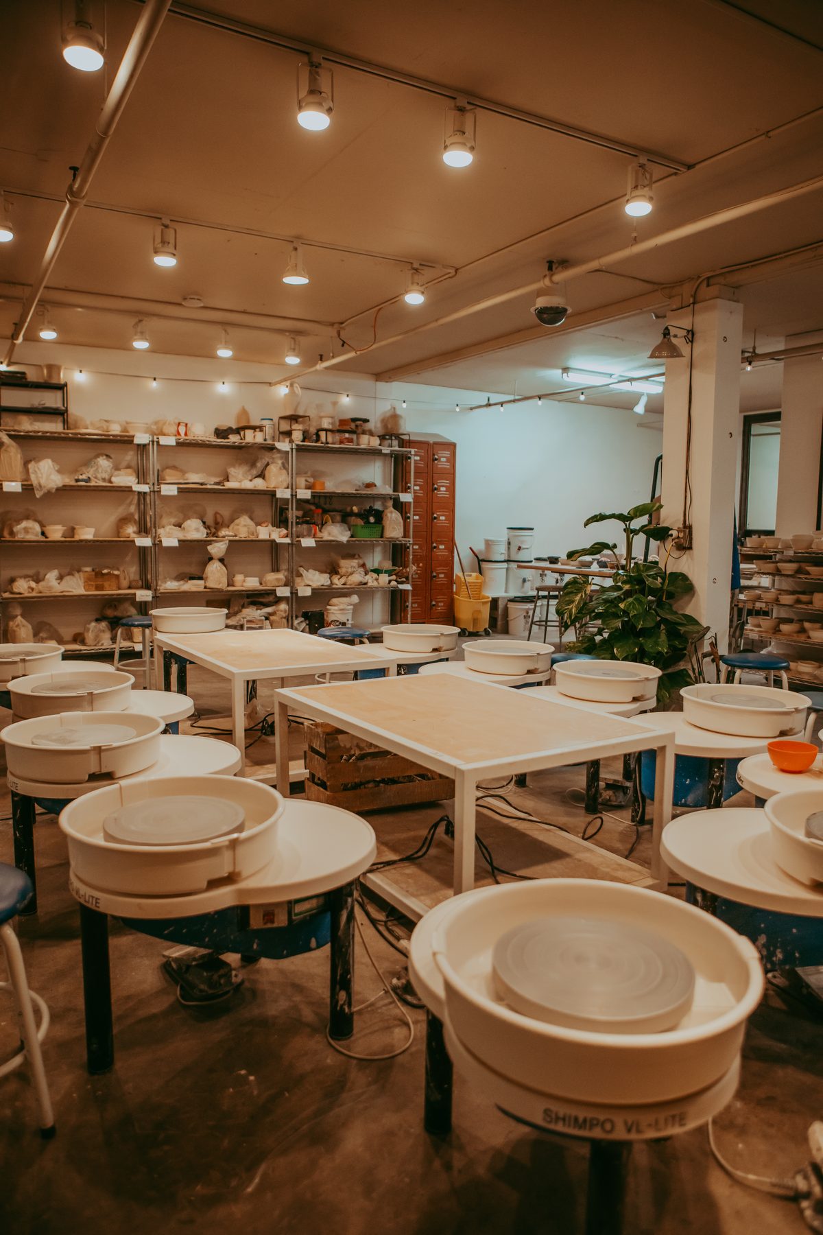 Pottery studio with wheels set up for hands-on workshops